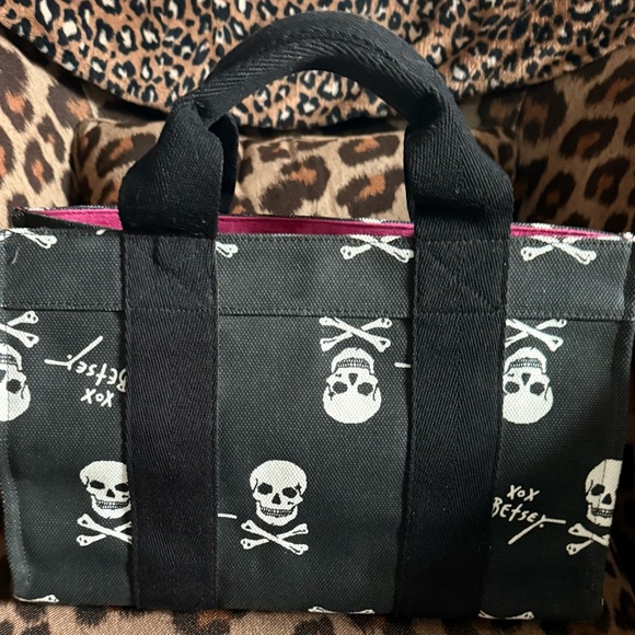 Betsey Johnson Handbags - Betsey Johnson Black Skull Print Satchel with Pink Trim